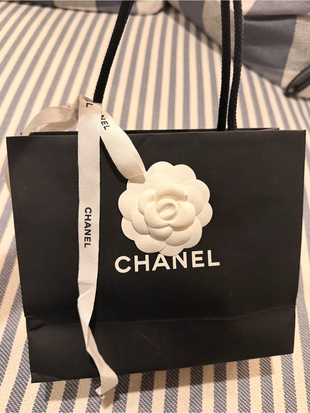 CHANEL Black Small Shopping Bag with White Camellia and Ribbon